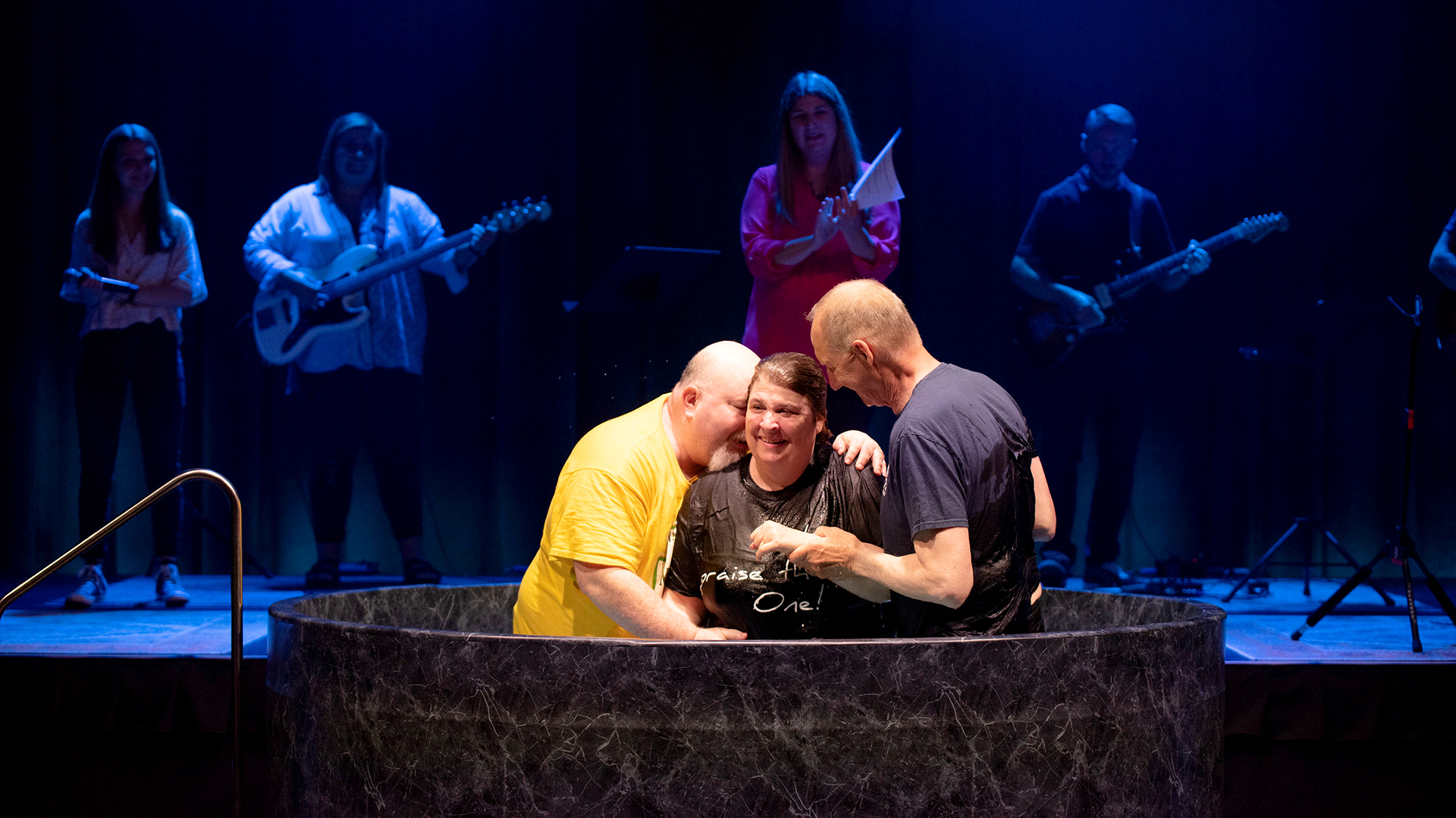 Adult being water baptized