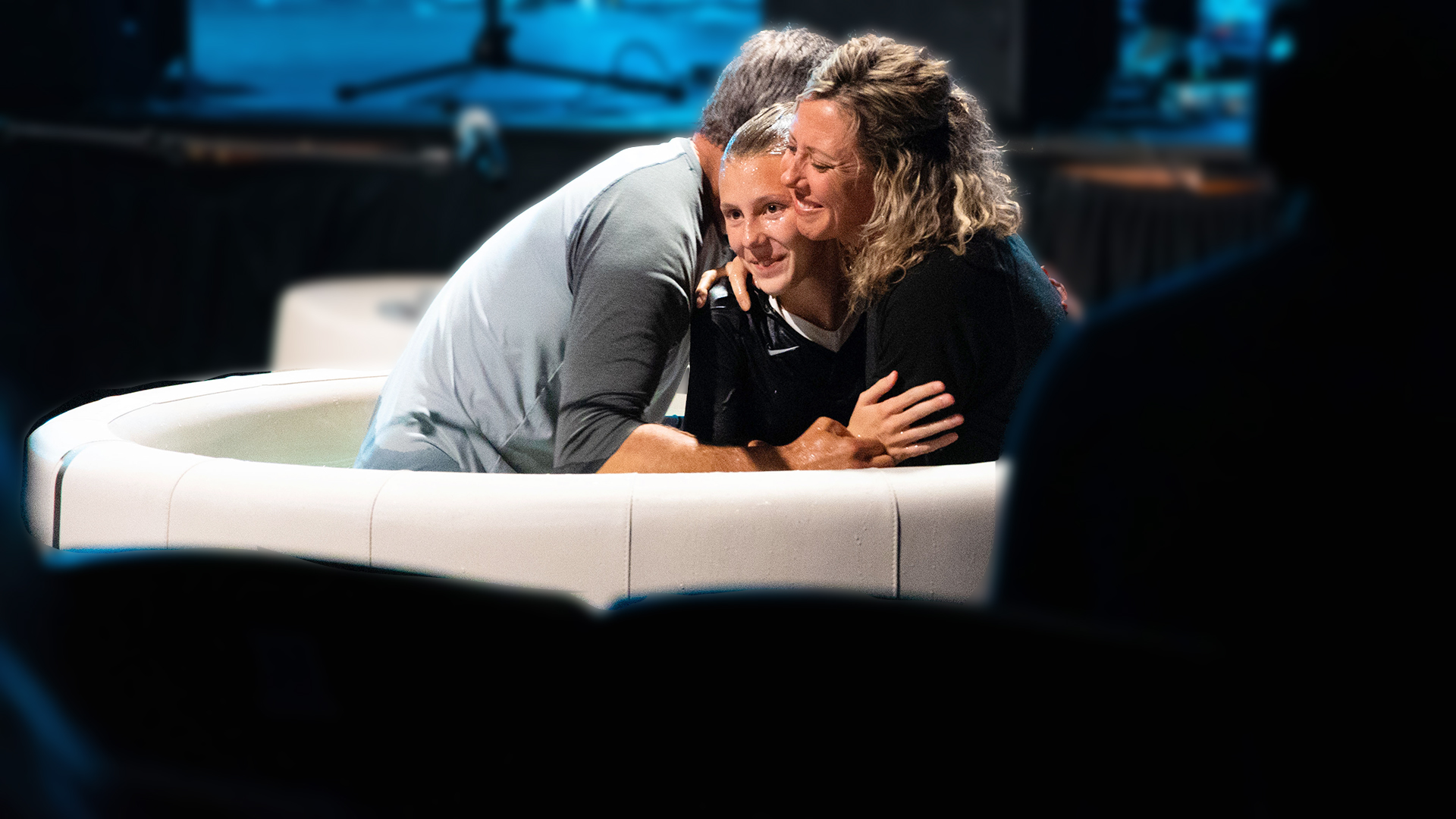 Student being water baptized