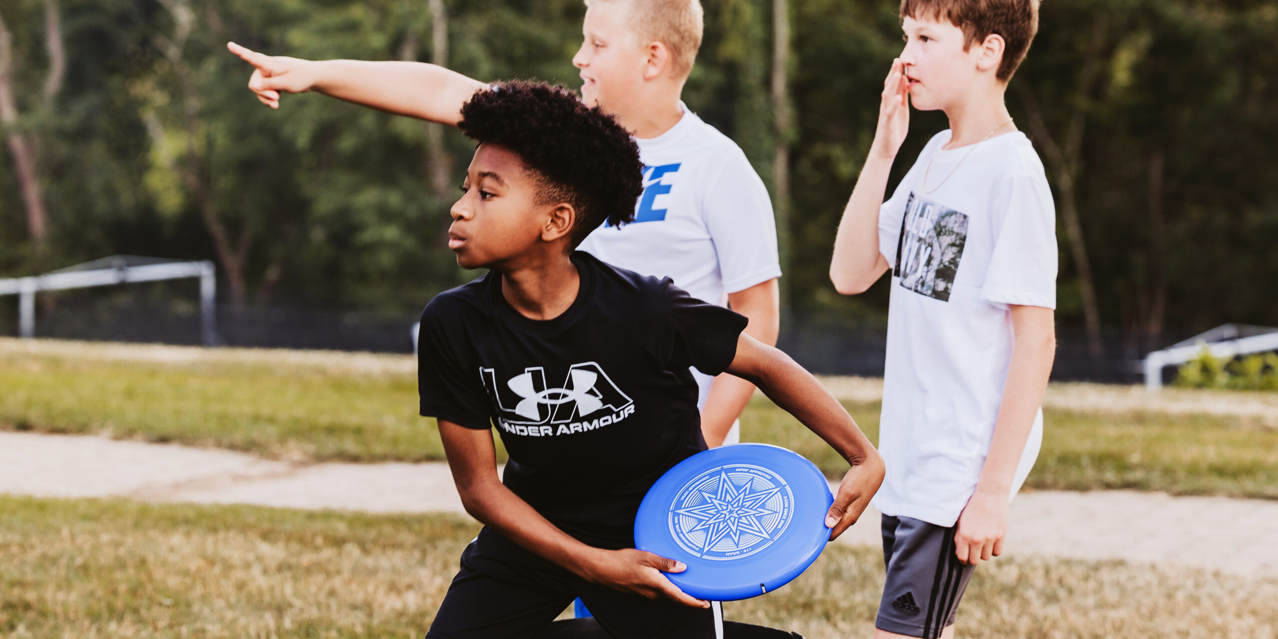 Students playing frisbee at a North Way Students event